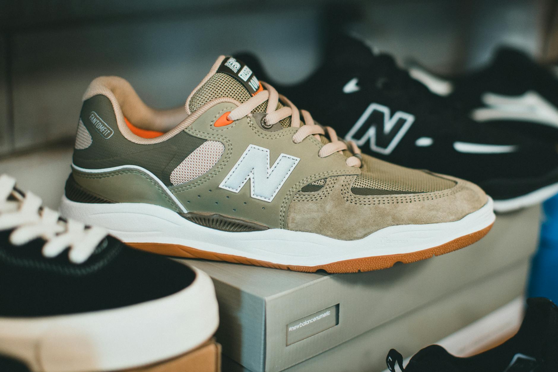 New Balance sneakers sizing guide with various models and colorways